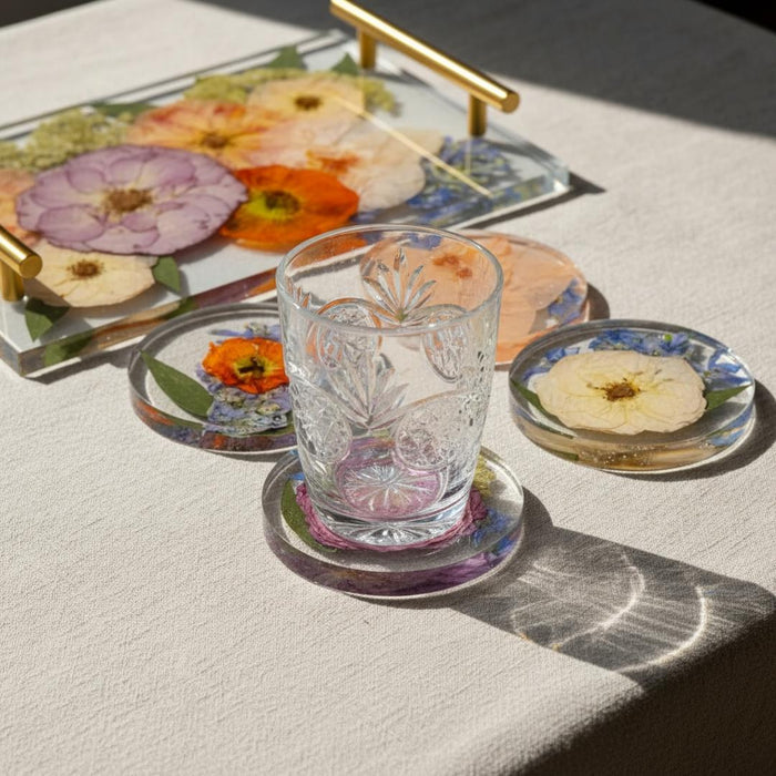 Resin tray with gold handles and round coasters preserving pressed roses, poppies and blue flowers, a flower preservation keepsake set.