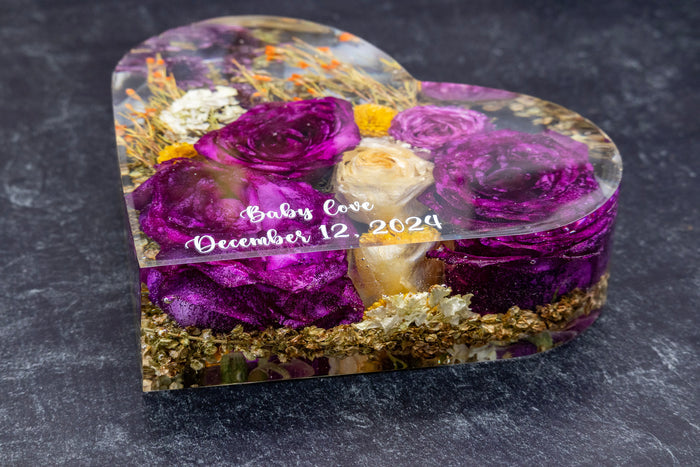 Heart-shaped resin box with purple and gold flowers on a dark background