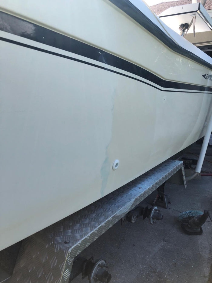 Side of boat showcasing a section that Aqua Blue 100 Fast Cut Compound was used on.