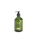 Green bottle with pump dispenser on a white background
