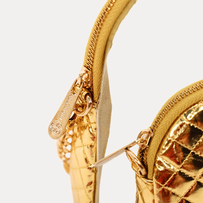 a close up of a gold purse