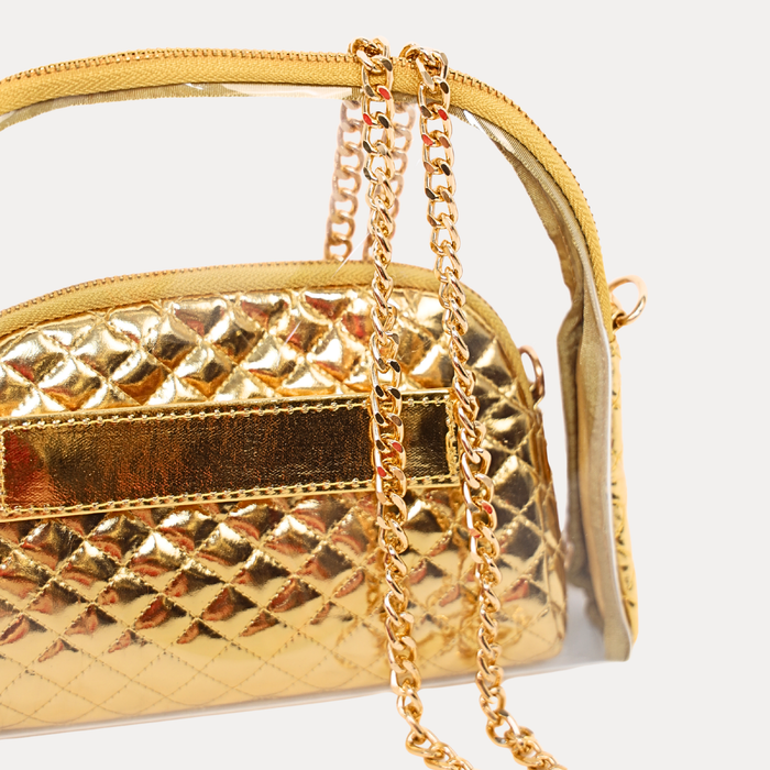a gold purse with a chain