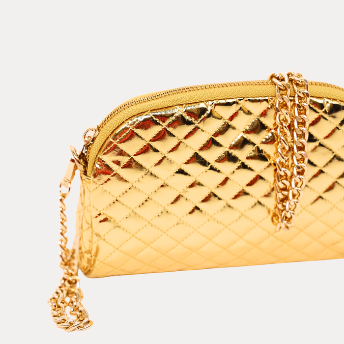 a gold purse with a chain