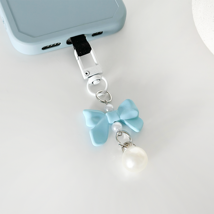 Blue bow phone keyring bundle with gold hardware, featuring a soft fabric bow and matching blue color accents.