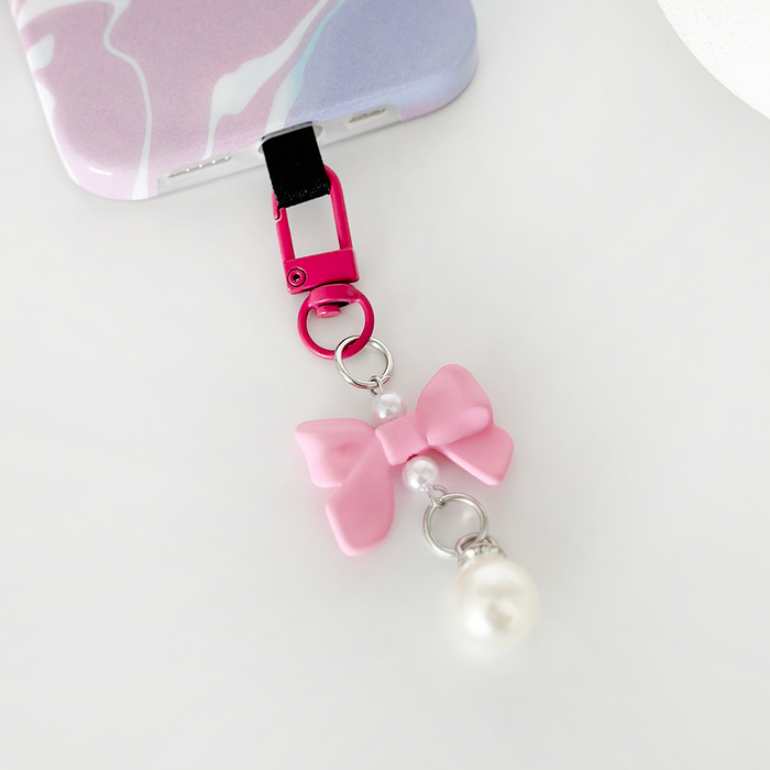 Bright pink phone case and matching bow keyring bundle from Coconut Lane.