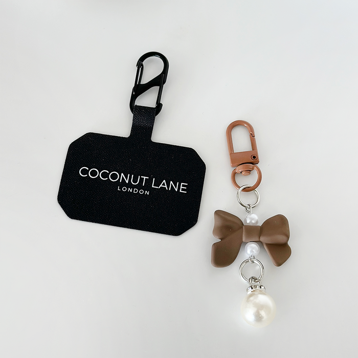 Brown Coquette Bow phone keyring bundle with pearls and a small charm, shown on a white background.