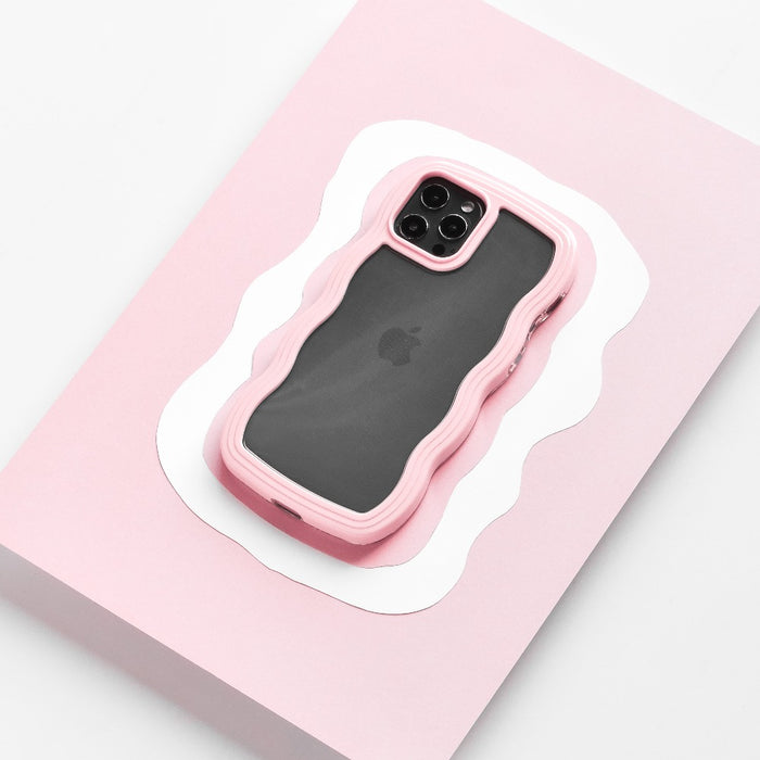 Smartphone in a pink Curvy Phone Case by Coconut Lane on pink and white paper background.