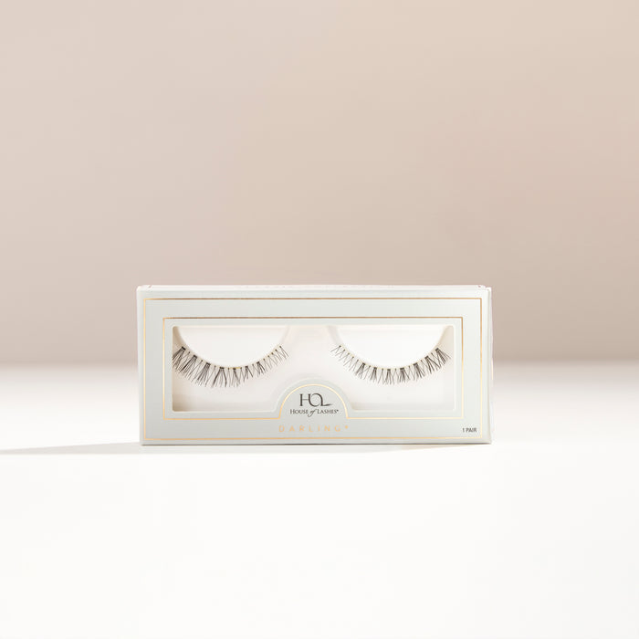 Darling lower lashes by House of Lashes in a pale blue box with a clear window and gold trim