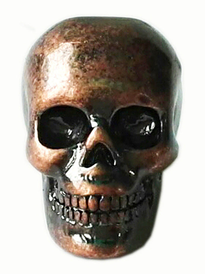 Copper skull hair bead with oxidized finish, front view