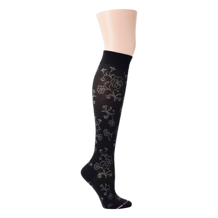 Knee-high black compression socks with a floral pattern and a solid cuff at the top.