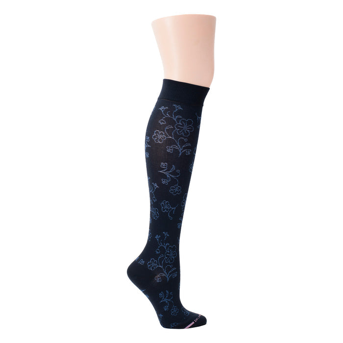 Knee-high compression socks with a floral pattern in blue on a dark background.