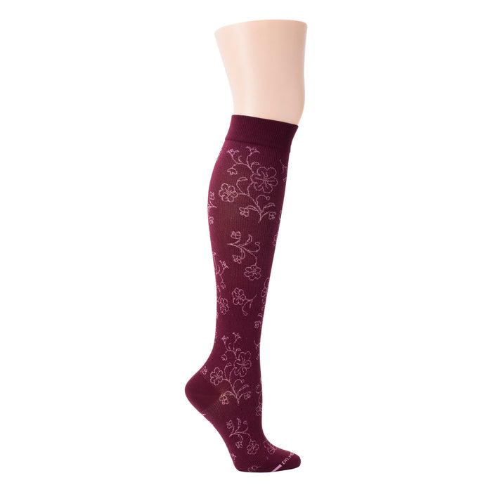 Knee-high compression socks in burgundy with a floral pattern and a ribbed top band.