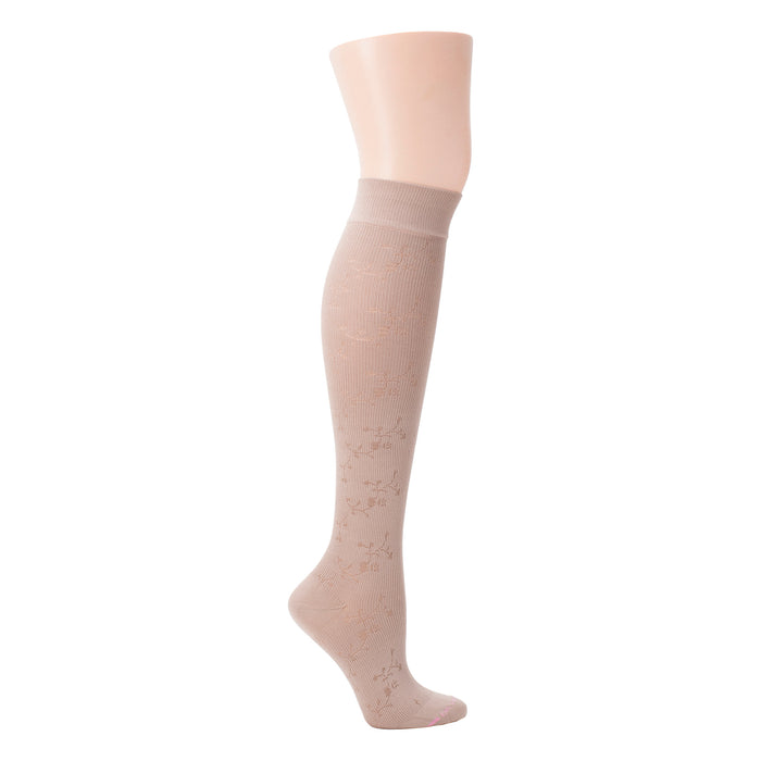 Knee-high compression socks in a floral texture, displayed on a mannequin leg.
