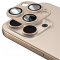Desert Titanium Coconut Lane camera lens cover being fitted onto a triple-lens iPhone.
