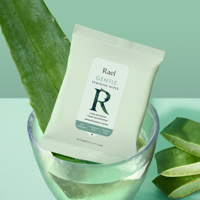 A package of Rael Gentle Feminine Wipes in a bowl with aloe vera, an included ingredient.