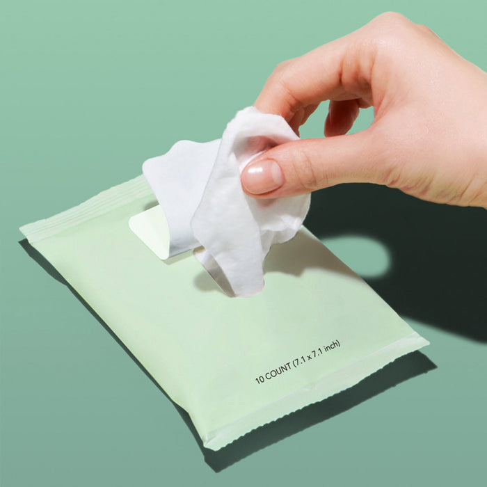 Model removing a wipe from a package of Rael Gentle Feminine Wipes
