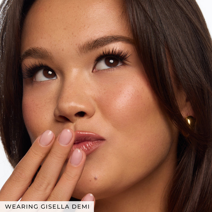 Close-up of a model’s eye with lush lashes and subtle makeup