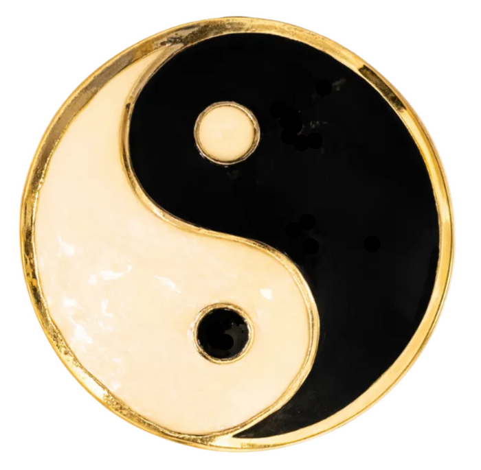 Gold yin yang hair hook ponytail holder, enamel symbol close-up on white background