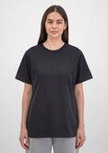 Person wearing a black t-shirt against a white background