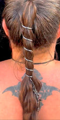Model wearing gunmetal black 6-inch spiral ponytail wrap securing a ponytail with black bead charm, back view