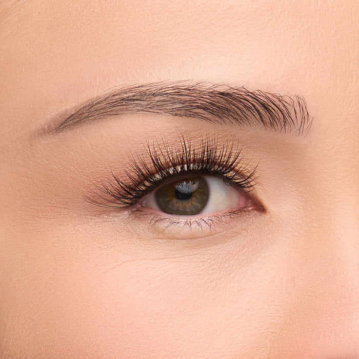 Heavenly Lite flared lash with center-focused density and wispy corners, creating a texturized 3D effect shown on an eye.