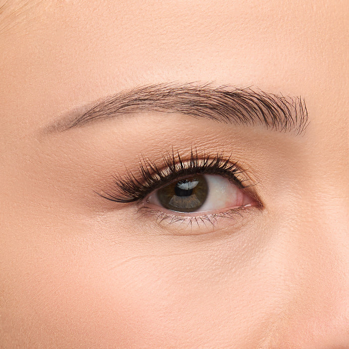 Iconic Demi a flared half lash with full volume, long length, and defined spiky fibers shown on an eye.