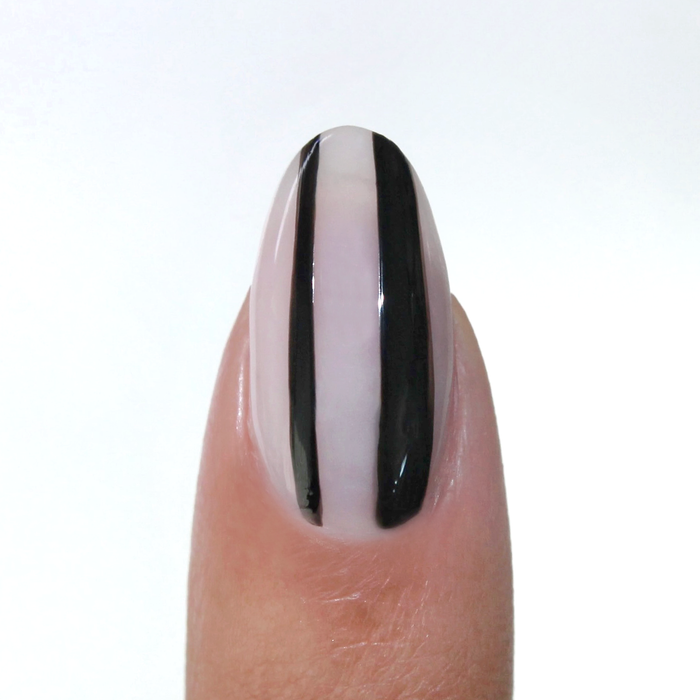Ink-redible black liner used for a black vertical stripe on a sheer nude nail