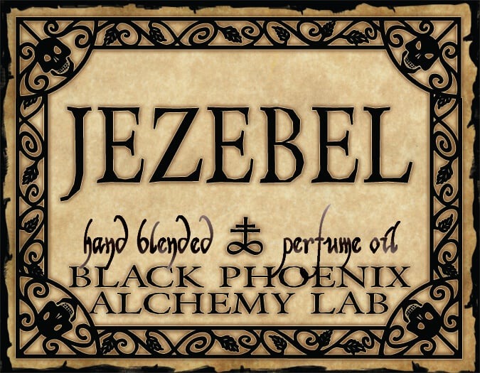 Label for 'Jezebel' hand blended perfume oil by Black Phoenix Alchemy Lab with decorative border.
