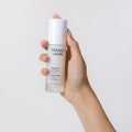 Hand holding France Laure Regenerate Jouvenance Intense Serum, 30ml bottle for youthful skin renewal and radiance