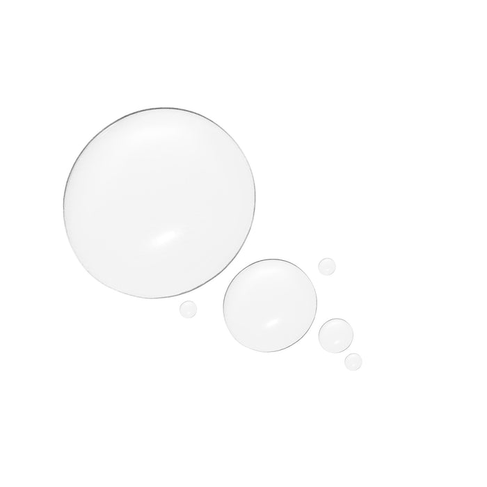 Clear skincare serum texture drops on a white background, close-up