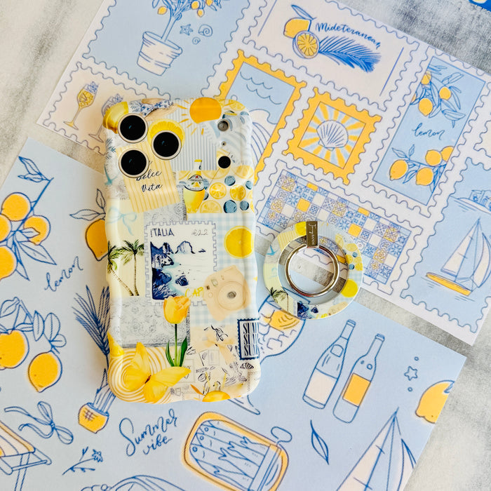 La Dolce Summer MagSafe phone grip ring with Mediterranean lemon, blueberry, blue gingham, and coastal travel lifestyle collage pattern compatible with iPhone and Samsung