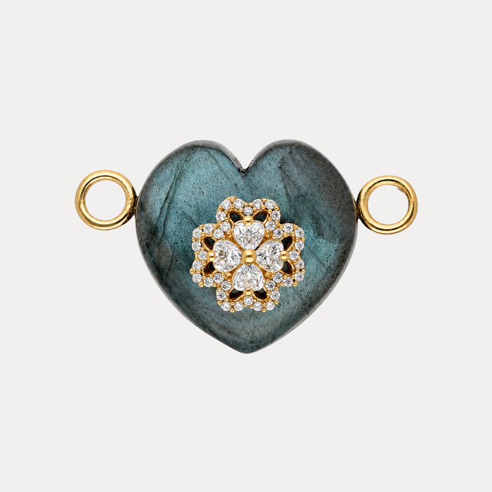 Labradorite Heart Charm featuring a pavé-trimmed crystal clover emblem on a dark iridescent stone.