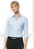 Lady wearing a blue Biz Collection Ladies micro check 3Q shirt in casual style