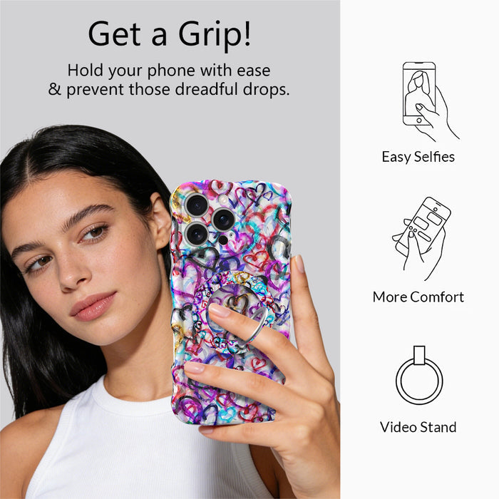 Love Out Loud colorful graffiti heart pattern MagSafe phone grip ring with overlapping neon pink purple and turquoise hearts compatible with iPhone and Samsung