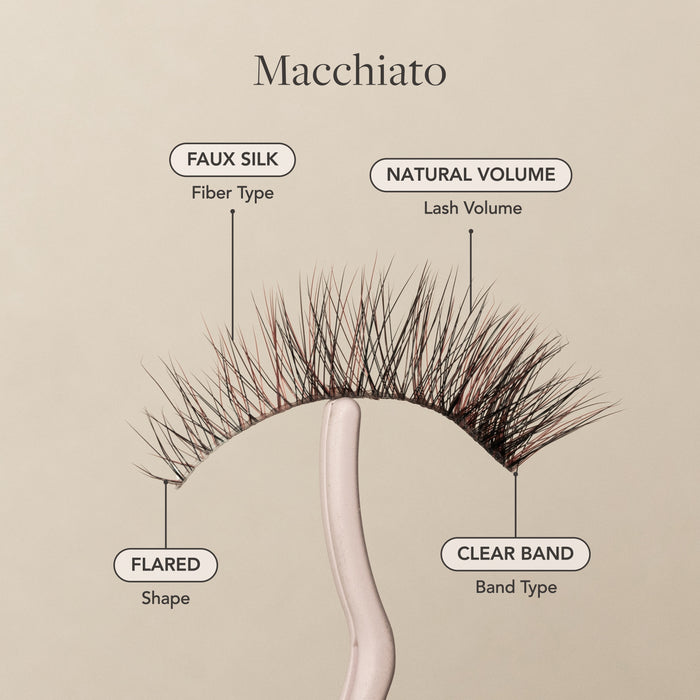 Macchiato false eyelashes with faux silk fibers, natural volume, flared shape, and a clear lash band.