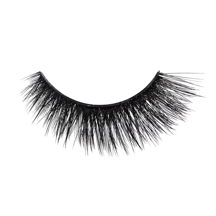 Close up of two curved black false eyelashes against a white background