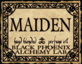 Label for 'MAIDEN' hand blended perfume oil by Black Phoenix Alchemy Lab with decorative border.