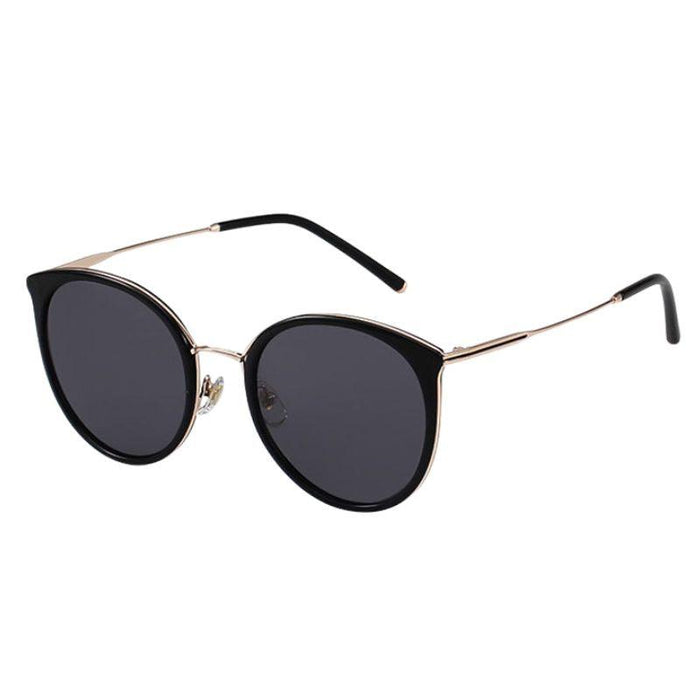 side view of Monaco Round Sunglasses in Black Gold. cat-eye vintage eyeglass frame, available in blue light blocking lenses and readers, photographed on a white background, from EyeCandys