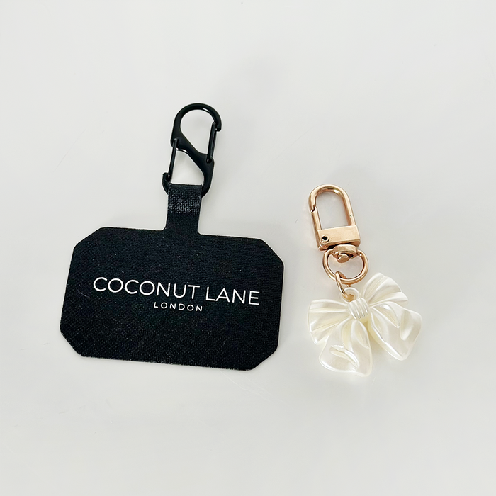 Gold Pearl Bow phone keyring bundle next to a black Coconut Lane tag.