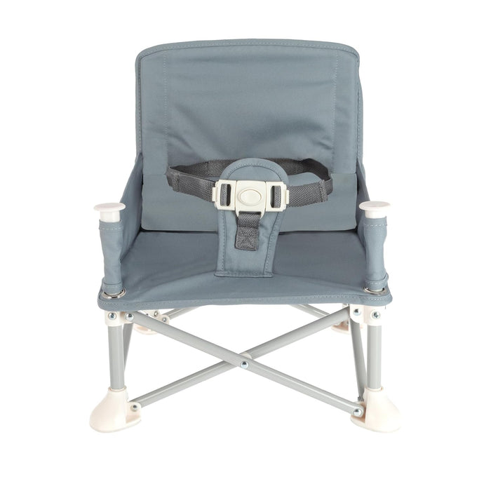The Nuby Pop Up Booster Seat | Grey is a small, portable booster for young children, featuring a fabric seat and backrest, safety harness, and sturdy metal legs.
