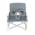 The Nuby Pop Up Booster Seat | Grey is a small, portable booster for young children, featuring a fabric seat and backrest, safety harness, and sturdy metal legs.
