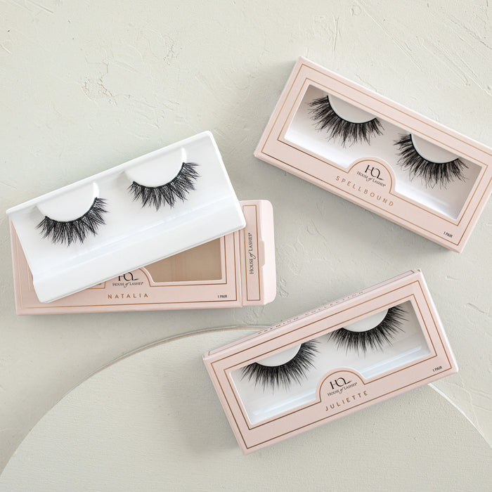 Premium Collection Custom 3-Pack false eyelashes shown in three pastel pink boxes
