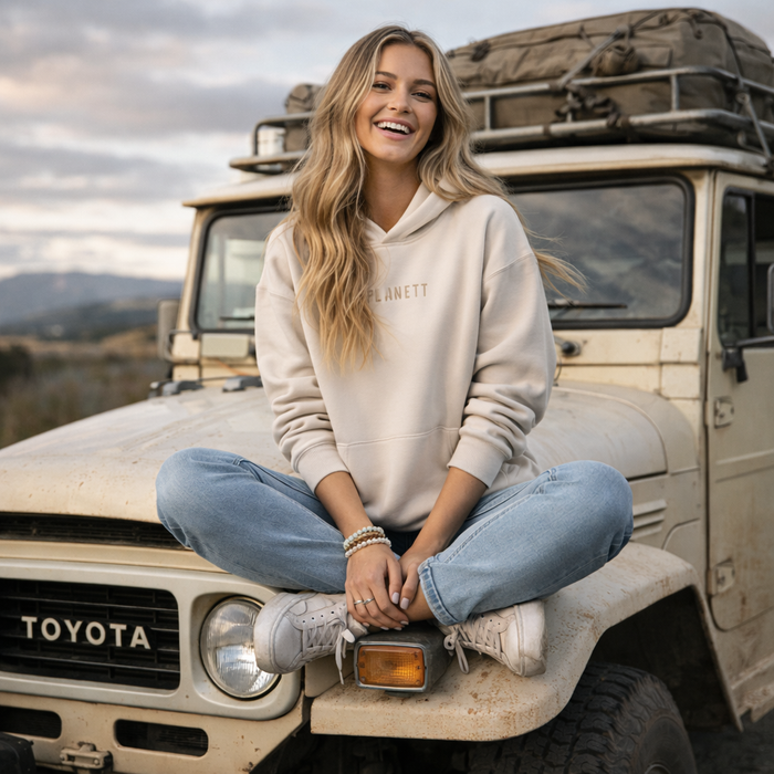 Beige premium oversized bone hoodie with soft casual fit and subtle gold lettering, great for workwear and uniforms