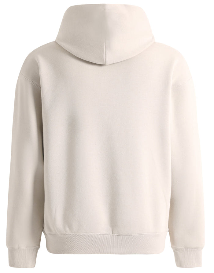 Cream-colored premium oversized bone hoodie with soft textured fabric and ribbed cuffs perfect for workwear uniforms