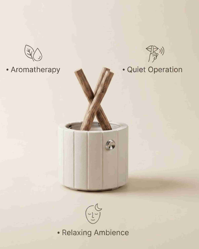 White ceramic aroma diffuser with stacked wooden logs and side control knob