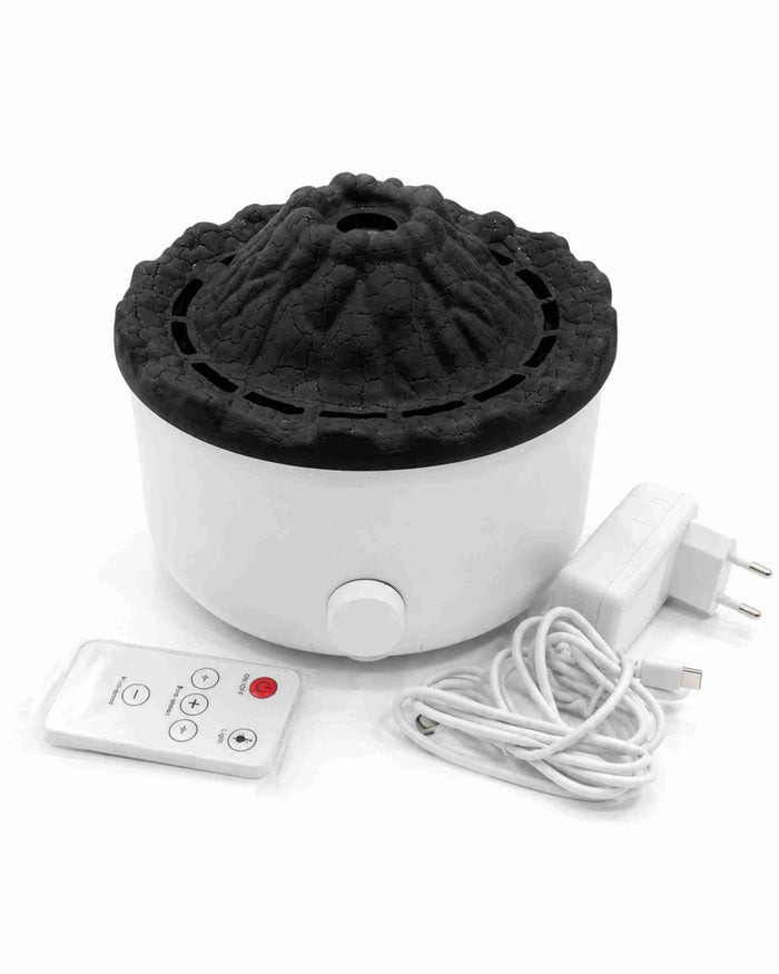 White aroma diffuser with black volcano-style lid and remote control panel