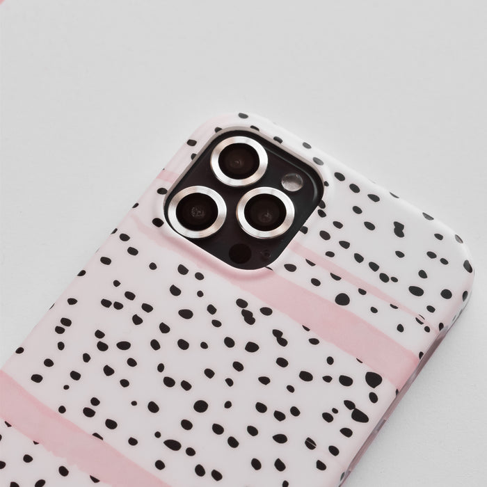 White Coconut Lane iPhone case with black dots, pink stripes, and silver camera lens covers.