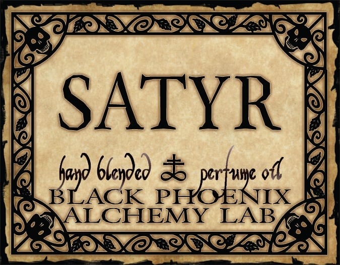 Label for 'Satyr' hand blended perfume oil by Black Phoenix Alchemy Lab with decorative border and text.