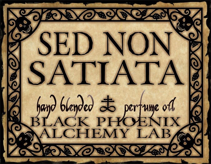 Vintage-style label for 'Sed Non Satiata' perfume oil by Black Phoenix Alchemy Lab.