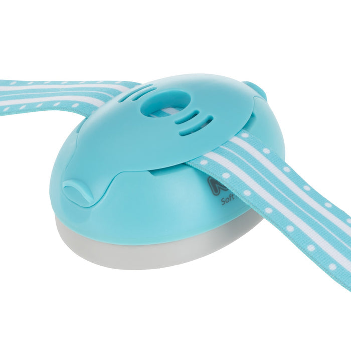 The Soft Sounds Baby Earmuffs | Blue are perfect for crafts using a blue and white safety cutter with a teal-striped ribbon, providing safe hearing protection for babies during activities involving fabric or ribbon cutting.